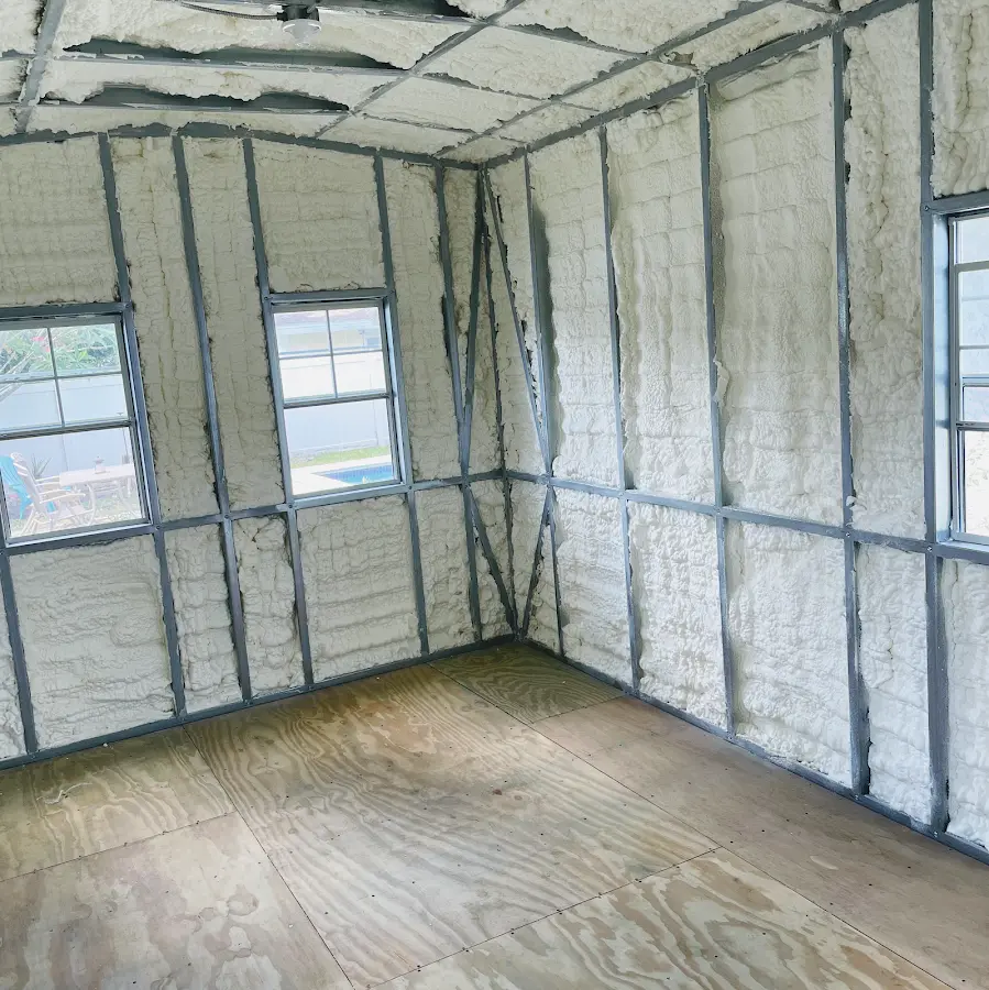 Closed-cell spray foam insulation applied to wall cavities in a residential project in Ottawa